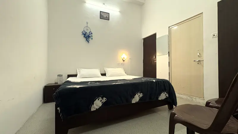 Room 5 bed with navy quilt